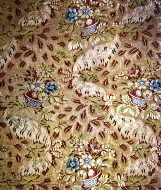 Floral woven textile in burgundy and green tones